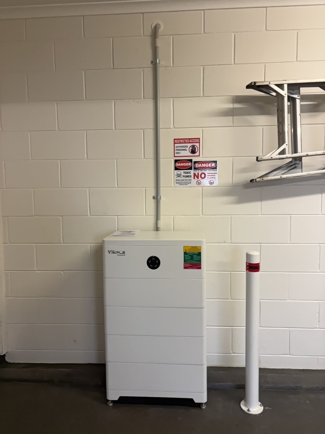 SolaX T-series battery stack, floor mounted with bollard guard