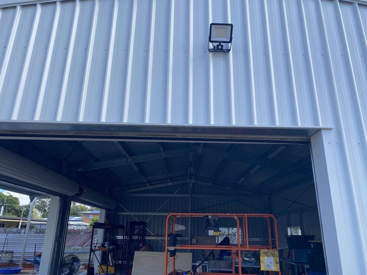 Shed job — exterior floodlight over roller door and LED battens inside